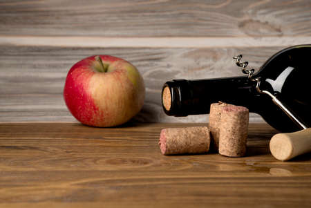 Bottles of apple and pear cider with fruits. Food and drinks concept. View from above, top studio shot. Flat lay, top view with copy artの写真素材