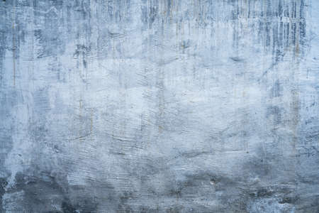 Dirty white painted dark concrete wall texture background artの写真素材