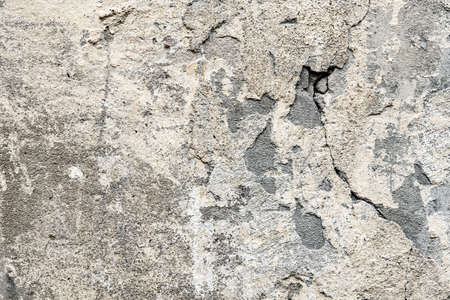 Fragment of the old wall with decaying and fallen off plaster artの写真素材