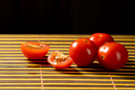 red cherry tomatoes on the mat only copy spaceの写真素材
