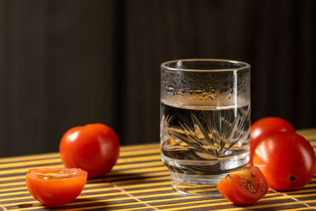 cherry tomatoes and vodka on the mat home styleの写真素材