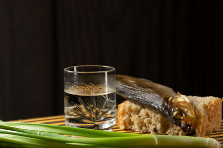 still alcoholic vodka fish fresh bread green onionsの写真素材