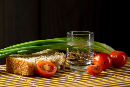 vodka vegetables still life on the mat home russian styleの写真素材