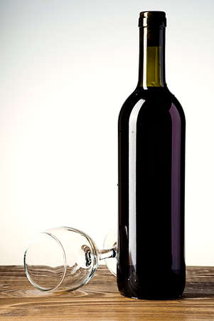 Wine bottle and glass on wooden background artの写真素材