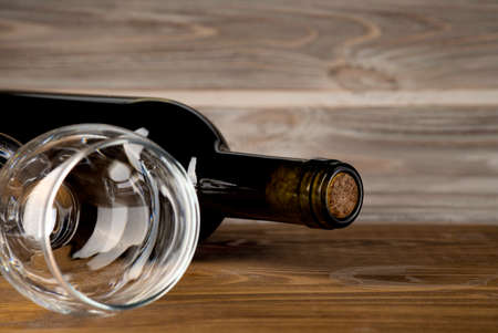 Wine bottle and glass on wooden background artの写真素材