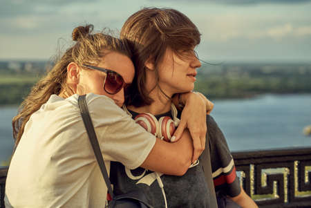 Two girls hugging each others after long time they have been distantの写真素材