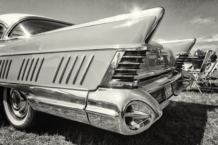 PAAREN IM GLIEN, GERMANY - MAY 19: The rear brake lights personal luxury car Buick Series 700 Limited Hardtop Sedan (1958), black and white, The oldtimer show in MAFZ, May 19, 2013 in Paaren im Glien, Germanyのeditorial素材