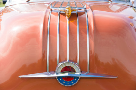 PAAREN IM GLIEN, GERMANY - MAY 19: The emblem on the hood of a two-door coupe Pontiac Star Chief, First generation (1954), The oldtimer show in MAFZ, May 19, 2013 in Paaren im Glien, Germanyのeditorial素材