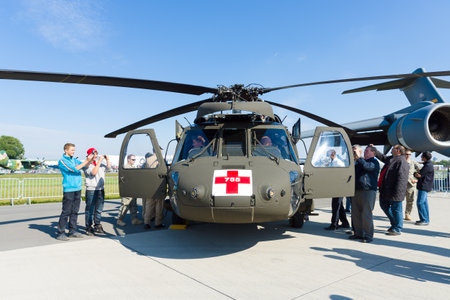 BERLIN - SEPTEMBER 14: Visitors view the helicopter Sikorsky HH-60 Blackhawk (USAF), International...