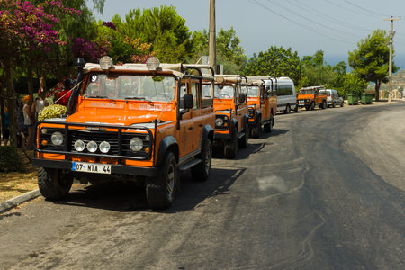 ALANYA, TURKEY - JUNE 27, 2014: Popular entertainment of tourists - the Jeep Safari. Ride off-road in the mountains. Beginning. Foothills. のeditorial素材