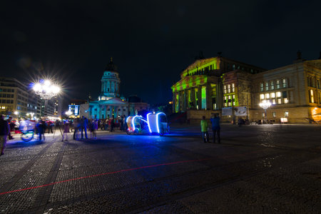 BERLIN, GERMANY - OCTOBER 10, 2014: Gendarmenmarkt square in the night illumination. The annual Festival of Lights 2014のeditorial素材