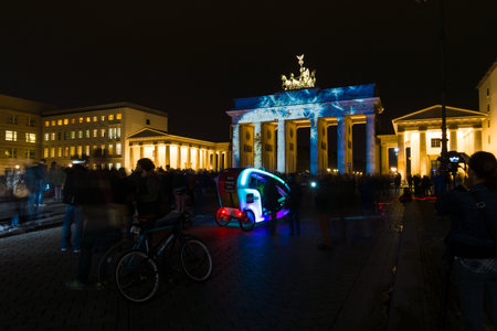BERLIN, GERMANY - OCTOBER 10, 2014 Brandenburg Gate and Pariser Platz in the night illumination. The annual Festival of Lights 2014のeditorial素材