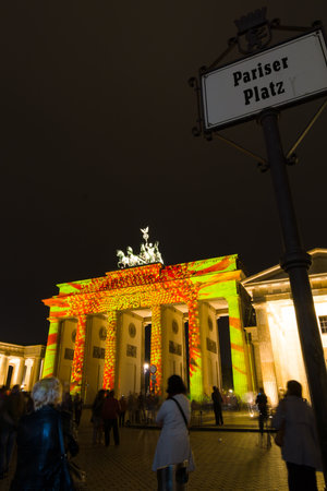 BERLIN, GERMANY - OCTOBER 10, 2014 Brandenburg Gate and Pariser Platz in the night illumination. The annual Festival of Lights 2014のeditorial素材