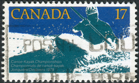 CANADA - CIRCA 1979: Postage stamp printed in Canada, dedicated to Canoe-kayak world championship, shows White water kayak race, circa 1979のeditorial素材