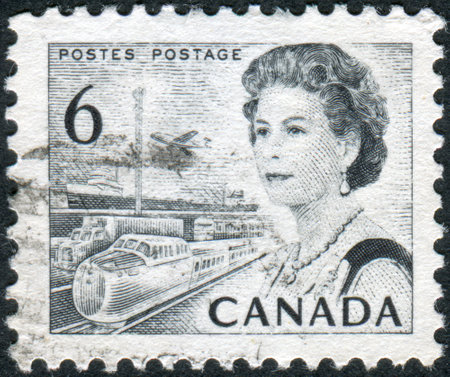 CANADA - CIRCA 1970: Postage stamp printed in Canada, shows Transportation Means, a portrait of Queen Elizabeth II, circa 1970のeditorial素材