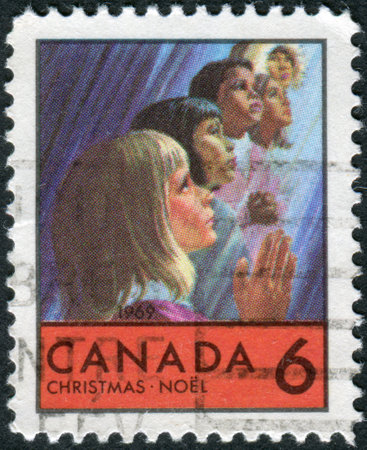 CANADA - CIRCA 1969: Postage stamp printed in Canada, Christmas issue, shows Children of Various races, circa 1969のeditorial素材