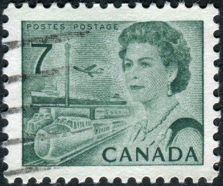CANADA - CIRCA 1971: Postage stamp printed in Canada, shows Transportation Means, a portrait of Queen Elizabeth II, circa 1971のeditorial素材