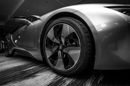 BERLIN - NOVEMBER 28, 2014: Showroom. The BMW i8, first introduced as the BMW Concept Vision Efficient Dynamics, is a plug-in hybrid sports car developed by BMW. Black and white.のeditorial素材