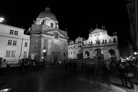 PRAGUE, CZECH REPUBLIC - SEPTEMBER 04, 2014: Saint Francis of Assisi Church and Christ Church of the Jesuit Order in the evening illumination. Black and white.のeditorial素材