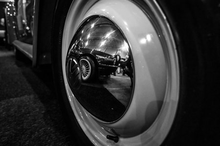 MAASTRICHT, NETHERLANDS - JANUARY 08, 2015: Reflections in the wheels. Black and white....