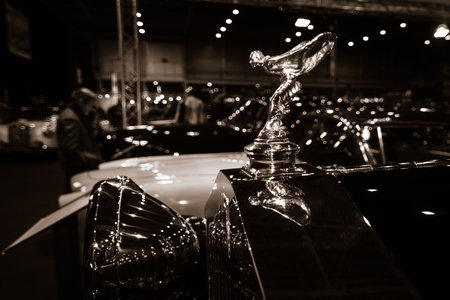 MAASTRICHT, NETHERLANDS - JANUARY 08, 2015: Hood ornament (Spirit of Ecstasy) of a Rolls-Royce 20/25 Sedanca de Ville by Gurney Nutting. Stylization. Sepia. International Exhibition InterClassics & Topmobiel 2015のeditorial素材
