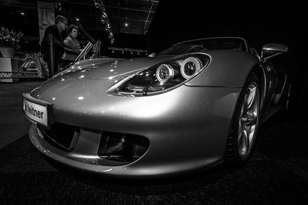 MAASTRICHT, NETHERLANDS - JANUARY 08, 2015: Supercar Porsche Carrera GT (Project Code 980), 2005. Black and white. International Exhibition InterClassics & Topmobiel 2015のeditorial素材