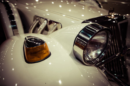 MAASTRICHT, NETHERLANDS - JANUARY 09, 2015: Fragment of a wedding limousine, neo-classic car Cmc Tiffany, built based on modern cars Ford. Stylization. Vintage toning. International Exhibition InterClassics & Topmobiel 2015のeditorial素材
