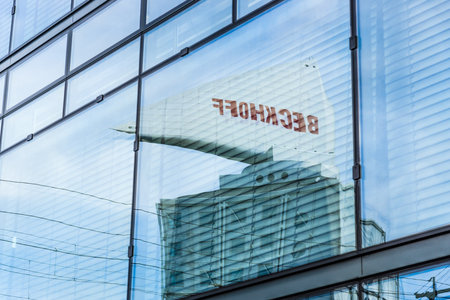 BERLIN - MARCH 08, 2015: Public advertising in the reflection. Beckhoff Automation GmbH & Co -...