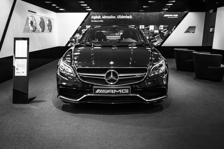 BERLIN - JANUARY 24, 2015: Showroom. Mid-size luxury car Mercedes-Benz CLS 63 AMG. Black and white. Produced since 2013.のeditorial素材