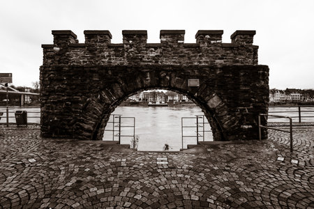 MAASTRICHT, NETHERLANDS - JANUARY 09, 2015: The ruins of the medieval gates and the fortress wall (Waterpoortje). Sepia. Stylization. Maastricht is the oldest city of the Netherlands and the capital city of the province of Limburg.のeditorial素材