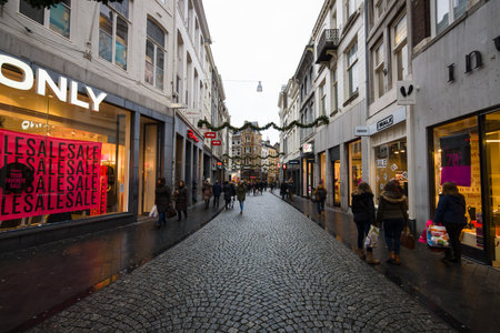 MAASTRICHT, NETHERLANDS - JANUARY 09, 2015: The narrow shopping streets in the historic center. Maastricht is the oldest city of the Netherlands and the capital city of the province of Limburg.のeditorial素材