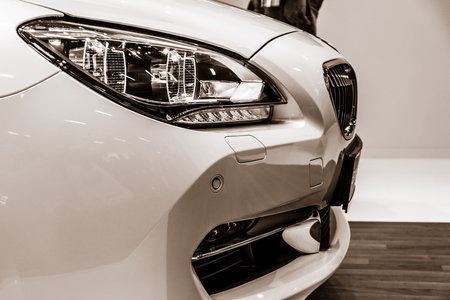 BERLIN - SEPTEMBER 09, 2012: Showroom. Detail of a Grand tourer / executive coupe BMW 640i Gran Coupe (F06). Stylization. Sepia. Produced since 2012.のeditorial素材