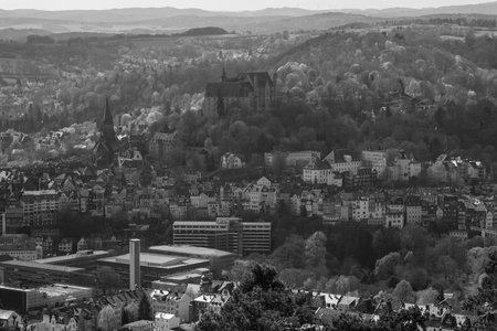 MARBURG, GERMANY - APRIL 18, 2015: The new and the old part of the city from the surrounding hills. Black and white. Marburg is a university town in the German federal state (Bundesland) of Hessen.のeditorial素材
