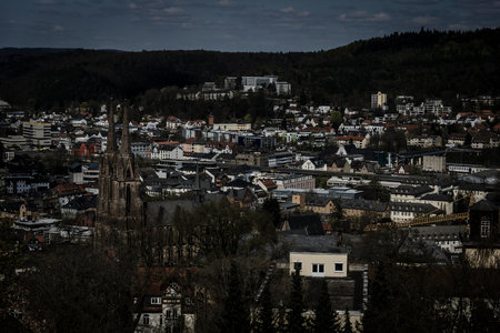 MARBURG, GERMANY - APRIL 18, 2015: The new and the old part of the city from the surrounding hills. Toning. Stylization. Marburg is a university town in the German federal state (Bundesland) of Hessen.のeditorial素材