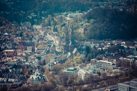 MARBURG, GERMANY - APRIL 18, 2015: The new and the old part of the city from the surrounding hills. Toning. Stylization. Marburg is a university town in the German federal state (Bundesland) of Hessen.のeditorial素材