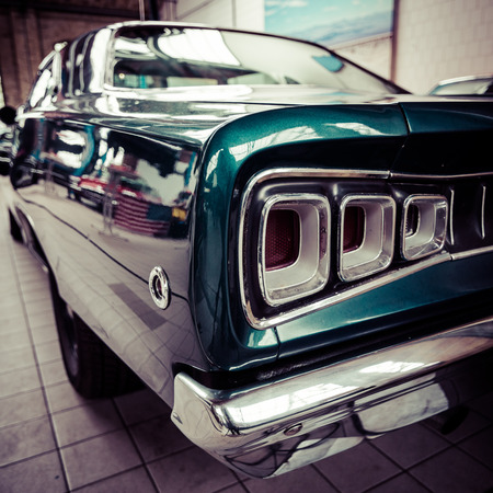 BERLIN - MAY 10, 2015: Stoplight of the Dodge Charger RT. Vintage toning. Stylization. 28th Berlin-Brandenburg Oldtimer Dayのeditorial素材