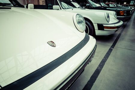 BERLIN - MAY 10, 2015: Cars in a row. In the foreground a Porsche 911. Stylization. Vintage toning. 28th Berlin-Brandenburg Oldtimer Dayのeditorial素材