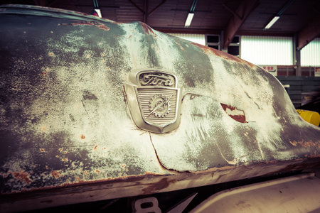PAAREN IM GLIEN, GERMANY - MAY 23, 2015: Fragment of rusted body of full-size pickup truck Ford F100. Stylization. Vintage toning. The oldtimer show in MAFZ.のeditorial素材