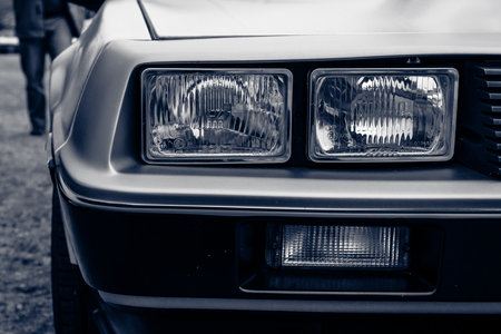 PAAREN IM GLIEN, GERMANY - MAY 23, 2015: Fragment of a sports car DeLorean DMC-12. Black and white. Toning. The oldtimer show in MAFZ.のeditorial素材