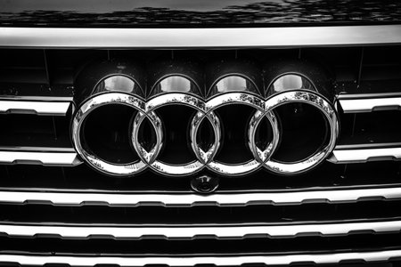 BERLIN - JUNE 14, 2015: The emblem on the front grille of a full-size luxury crossover SUV Audi Q7 3.0 TDI quattro. Black and white. The Classic Days on Kurfuerstendamm.のeditorial素材