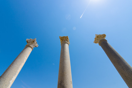 Ancient ruins of Perge on a background of blue sky. Optical glare from the sun. Turkey.の写真素材