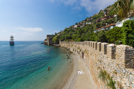 ALANYA, TURKEY - JULY 04, 2015: Shipyard (Tersane) and the ruins of a medieval fortress (Alanya Castle) on the mountainside.のeditorial素材