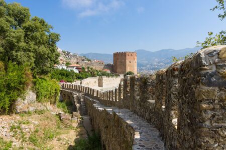 Red Tower (Kizil Kule) and the ruins of the fortress wall. The Mediterranean coast. Alanya. Turkeyの写真素材