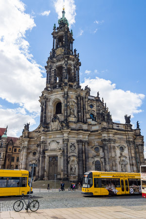 DRESDEN, GERMANY - SEPTEMBER 09, 2015: Cathedral of the Holy Trinity (Katholische Hofkirche) and the city tram. Dresden is the capital city of the Free State of Saxony.のeditorial素材