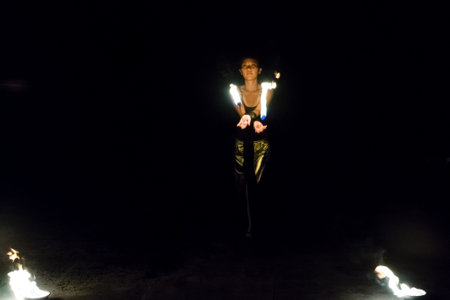 AVSALLAR, TURKEY - JUNE 30, 2015: Fire show. Evening performance on the beach for vacationers. Anatolian coast - a popular holiday destination in summer of European citizens.のeditorial素材