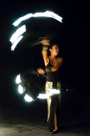 AVSALLAR, TURKEY - JUNE 30, 2015: Fire show. Evening performance on the beach for vacationers. Anatolian coast - a popular holiday destination in summer of European citizens.のeditorial素材