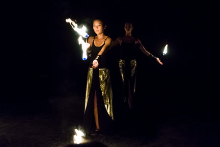 AVSALLAR, TURKEY - JUNE 30, 2015: Fire show. Evening performance on the beach for vacationers. Anatolian coast - a popular holiday destination in summer of European citizens.のeditorial素材