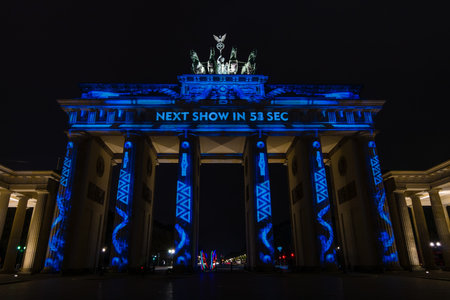 BERLIN, GERMANY - OCTOBER 13, 2015: Brandenburg Gate in night illumination. The annual Festival of Lights 2015のeditorial素材