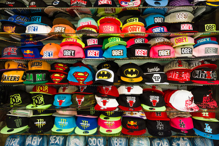 SIDE, TURKEY - JULY 07, 2015: Baseball caps with different brand names. Shop on the waterfront. Anatolian coast - a popular holiday destination in summer of European citizens.のeditorial素材