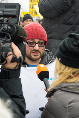 BERLIN - JANUARY 23, 2016: Russian Diaspora in Berlin protesting against migrants and refugees due to the sexual abuse of women and children.のeditorial素材
